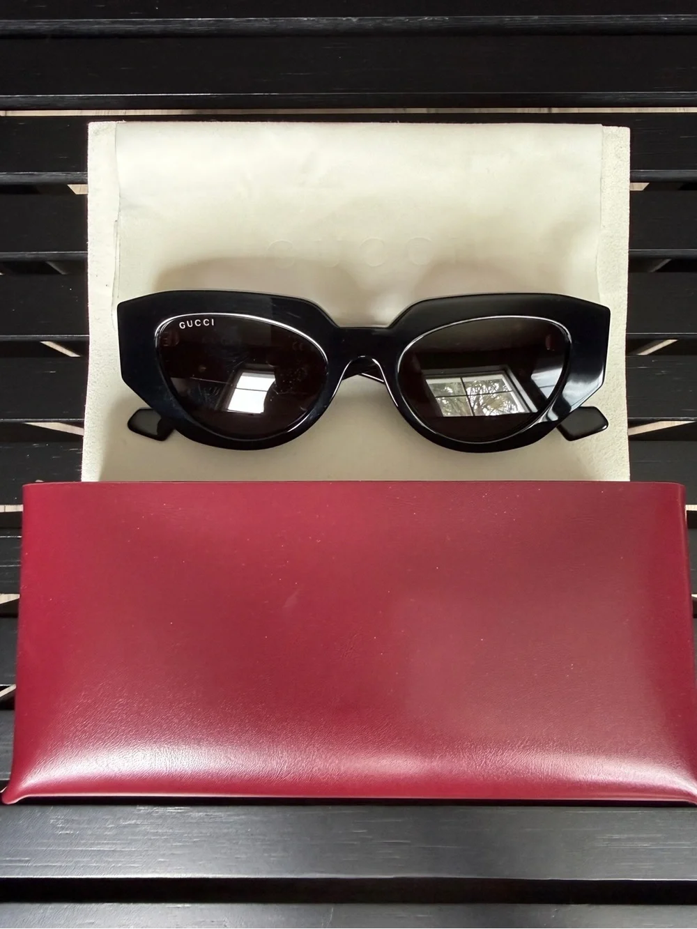 Gucci Black Oval Women's Sunglasses with Dark Lenses